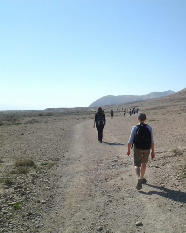 Walkers on a desert trail in Israel.