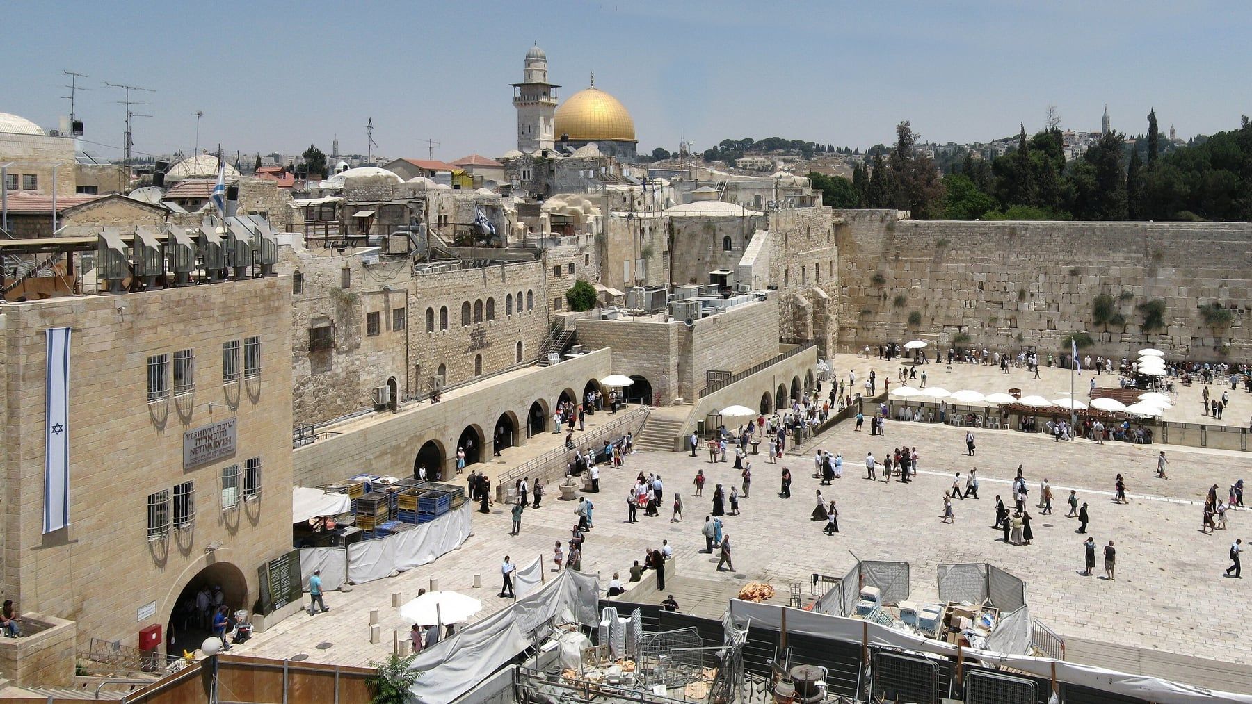 The Western Wall plaza in Jerusalem, with the gold Dome of the Rock behind it.